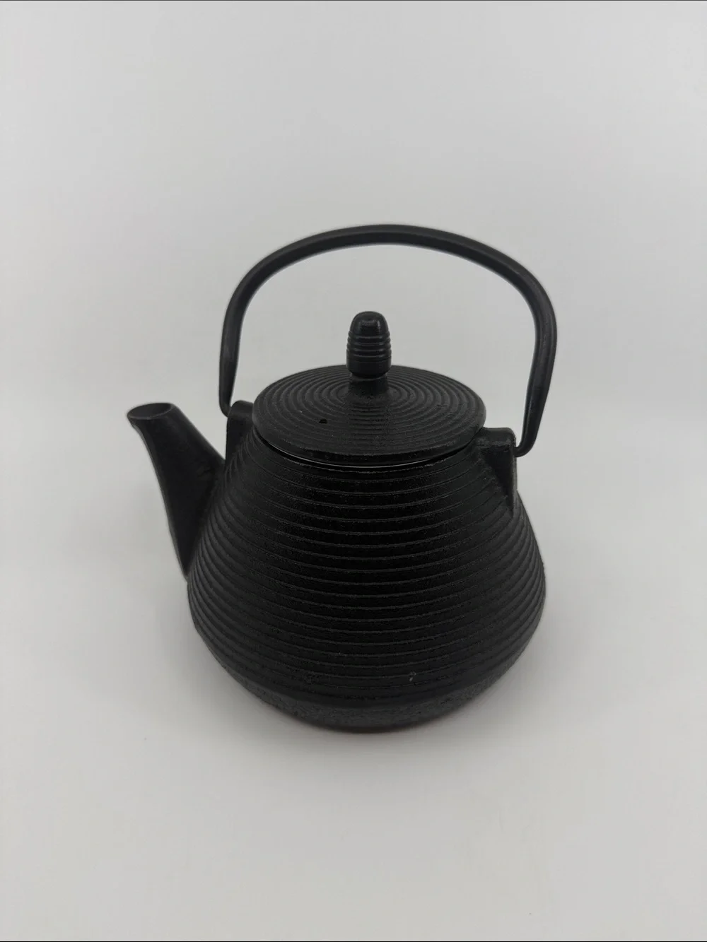 Elegant Black Cast Iron Teapot with Textured Finish